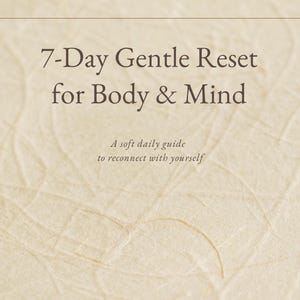May include: A book cover with the title "7-Day Gentle Reset for Body & Mind" in a serif font. The cover has a textured, light beige background. The text "A soft daily guide to reconnect with yourself" is below the title. The author's name is Julia Simon.