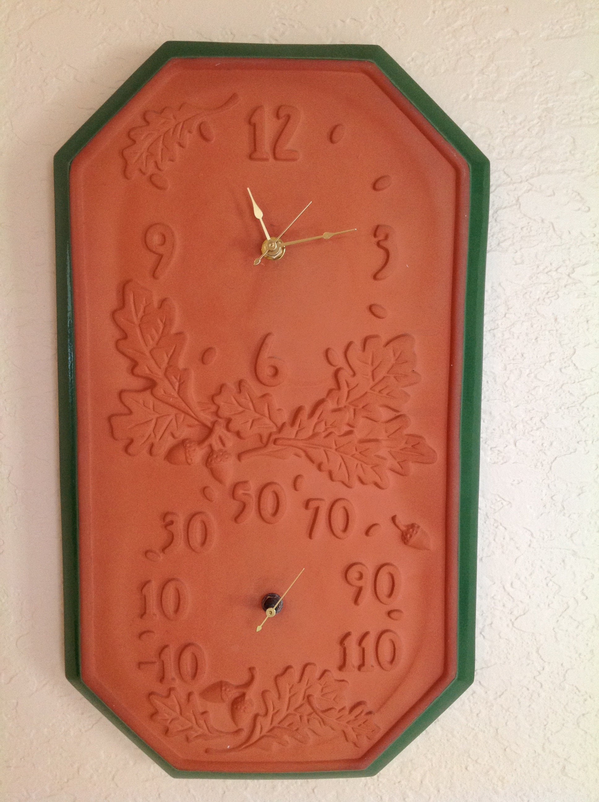 terra cotta clock and thermometer