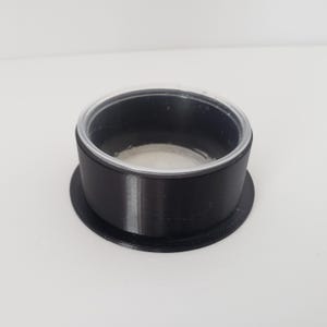 May include: A set of three ceramic mugs with a speckled, matte finish. The mugs are in shades of cream, light gray, and dark gray. Each mug has a simple, minimalist design, perfect for coffee or tea.