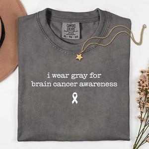 Camiseta Comfort Colors para la concientización sobre tumores cerebrales, camiseta con lazo gris para la concientización sobre el cáncer cerebral, regalo para sobrevivientes de tumores cerebrales, camiseta de apoyo para personas con tumores cerebrales.