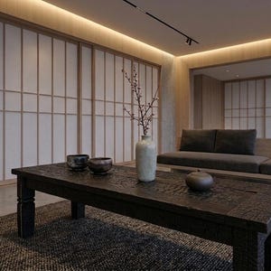 May include: A contemporary living room featuring a dark wood coffee table, a grey sofa, and a neutral rug. The table measures 45 cm high, 140 cm wide, and 40 cm long. Decorative elements include vases and bowls.