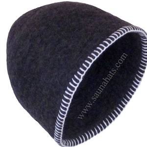 May include: A dark gray felt sauna hat with a white stitched trim. The hat has the text "www.saunahats.com" printed on the side.