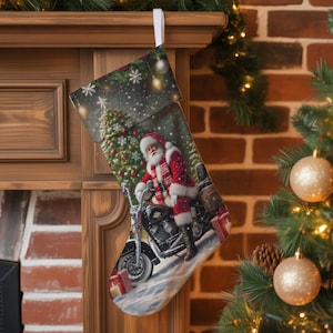 May include: Christmas stocking featuring Santa Claus on a motorcycle, with a Christmas tree and falling snow in the background. The stocking is red, white, and black, with a white loop for hanging. Presents are at the bottom of the stocking.