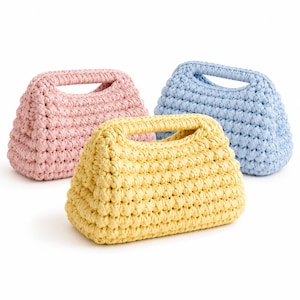 May include: Three small handbags crafted from thick, textured yarn in pastel colors. One bag is light pink, one is light blue, and one is pale yellow. Each bag features a rectangular base, a structured shape, and an integrated top handle opening.