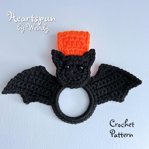 May include: Crochet pattern for a black bat with orange hat. The bat is a ring holder. The pattern is called "Heartspun by Wendy".