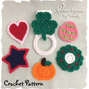 May include: Crochet pattern for a set of six different shapes: a heart, a four-leaf clover, a pumpkin, a star, a wreath, and an egg. The shapes are crocheted in various colors, including red, green, orange, blue, and white.