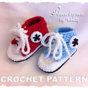 May include: A crochet pattern for baby shoes that look like Converse sneakers. The shoes are red and blue with white laces and black stars.