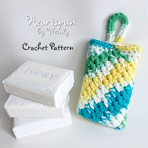 May include: Crochet soap saver with a hanging loop, made in a colorful chevron pattern of turquoise, white, yellow, and green yarn. The text "Heartspun by Wendy Crochet Pattern" is written above the soap saver.