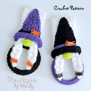 May include: Two crocheted witch gnome ornaments with black and white braids, purple and black hats, and orange spider embellishments. The text "Heartspun by Wendy" is visible below the ornaments. Crochet Pattern.
