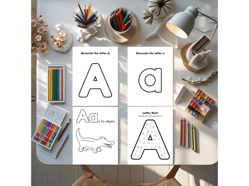 May include: Four white activity sheets with the letter "A" are displayed, along with colored pencils and crayons. The sheets include the text "Decorate the letter A", "A is for alligator", and "Letter Hunt". The image is taken from an overhead perspective.