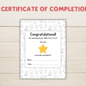 May include: A white certificate with the text "CERTIFICATE OF COMPLETION" in red. The certificate has a border of cartoon animals and the text "Congratulations!! For learning all your ABCs from A to Z". A yellow star is in the center.