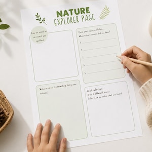May include: A white Nature Explorer Page with prompts for drawing, writing, and leaf collection. A hand holds a pencil, completing the page. A basket with leaves and a pinecone sits nearby.