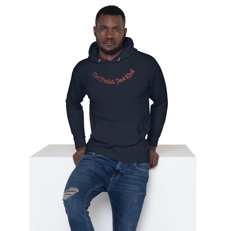 Unisex HoodieNot Perfect, Just Real tee — raw, unapologetic, and fearless. Wear your truth, no filter, no excuses