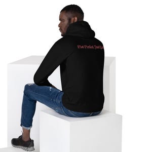 Unisex HoodieNot Perfect, Just Real tee — raw, unapologetic, and fearless. Wear your truth, no filter, no excuses