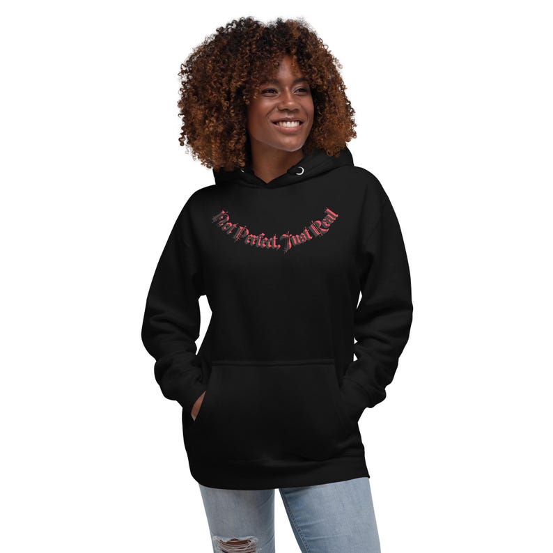 Unisex HoodieNot Perfect, Just Real tee — raw, unapologetic, and fearless. Wear your truth, no filter, no excuses