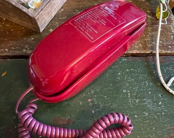 Teléfono Bell Atlantic Supertrim modelo (HAC) BA-3000 de 1994, color rojo oscuro.