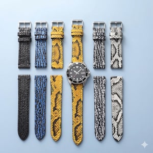 May include: A collection of watch straps in various colors and textures, including black, blue, yellow, and gray. One watch with a black face and silver casing is displayed with a yellow strap. The straps are arranged on a light blue background.
