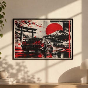 Puede incluir: Una impresión de arte mural rectangular que muestra un coche deportivo negro visto desde atrás, situado en una carretera cerca de una puerta torii. La escena incluye un gran sol rojo, una montaña nevada y ramas de cerezo en tinta negra y roja.