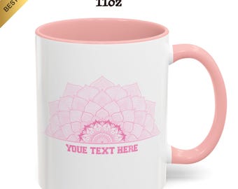 May include: White 11oz accent coffee mug with a pink interior and handle. The mug features a pink mandala design and the text "YOUR TEXT HERE". A gold "BEST SELLER" banner is in the upper left corner.