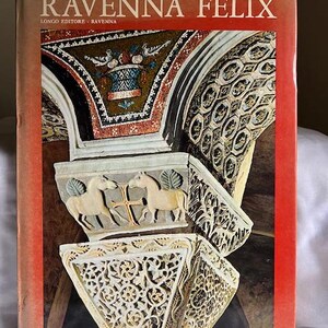 May include: A vintage book titled "Ravenna Felix" by Longo Editore, Ravenna. The cover features a close-up of intricate stonework with a mosaic ceiling in the background.