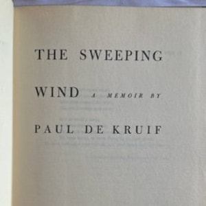 May include: The cover of a book titled "The Sweeping Wind" by Paul de Kruif. The book is a memoir.