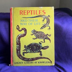 May include: A vintage Golden Library of Knowledge book titled "Reptiles and Their Way of Life". The cover features illustrations of a snake, a lizard, a turtle, and a horned toad on a yellow background.
