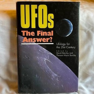May include: A book titled "UFOs The Final Answer?" features a black cover with yellow and orange text. The cover art includes a blue planet and a purple and gray celestial design. The book is about Ufology for the 21st Century.