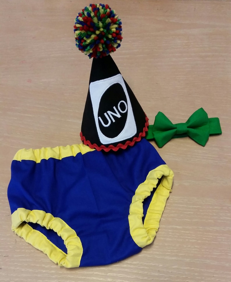 Uno birthday cake smash Boy cake smash outfit primary colors red blue green and yellow cake smash outfit