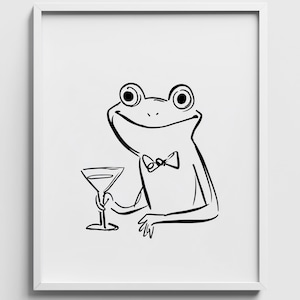 May include: Black and white line drawing of a frog in a bow tie, holding a martini glass. The frog has a cheerful expression. The artwork is presented in a white frame.
