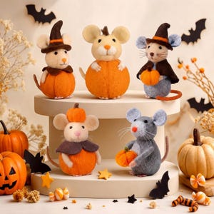 May include: Five needle-felted mice figurines arranged on a tiered display. Three mice wear brown witch hats and capes, while two mice are integrated into orange pumpkin shapes. The mice are cream, gray, and white with small orange felt pumpkins.