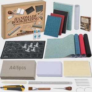 May include: A comprehensive handmade bookbinding kit featuring a cardboard box labeled HANDMADE BOOKBINDING, a black cutting mat, various colored fabric sheets, A4 cardboard pieces, white paper stacks, a metal ruler, needles, glue, and tools.