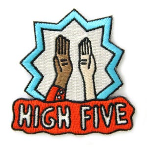 May include: Embroidered patch featuring two hands giving a high five. The hands are depicted with different skin tones, set against a white background within a blue starburst design. The words "HIGH FIVE" are in orange.