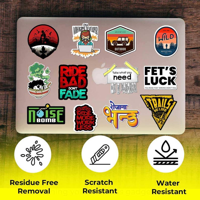 May include: A collection of colorful stickers on a laptop. The stickers feature various designs, including text, illustrations, and logos. Some stickers have phrases like "Ride Bad Don't Fade" and "Fet's Luck". The stickers are residue-free, scratch-resistant, and water-resistant.