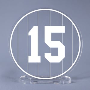 May include: White acrylic table number with a baseball-style design. The number 15 is printed in white on a white background with black lines.