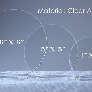 May include: Clear acrylic display stands in three sizes: 6" x 6", 5" x 5", and 4" x 4". Each stand is a clear circle with a rectangular base. The material is clear acrylic.