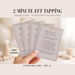 May include: A hand holds a stack of 10 printable cards with text: "2 Minute EFT Tapping - Tapping Scripts - Physical Pain & Tension Relief." The cards have a gold border and text. The words "Digital Download" are also visible.