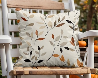 Housse de coussin à feuilles beige et noire : décoration d'automne moderne
