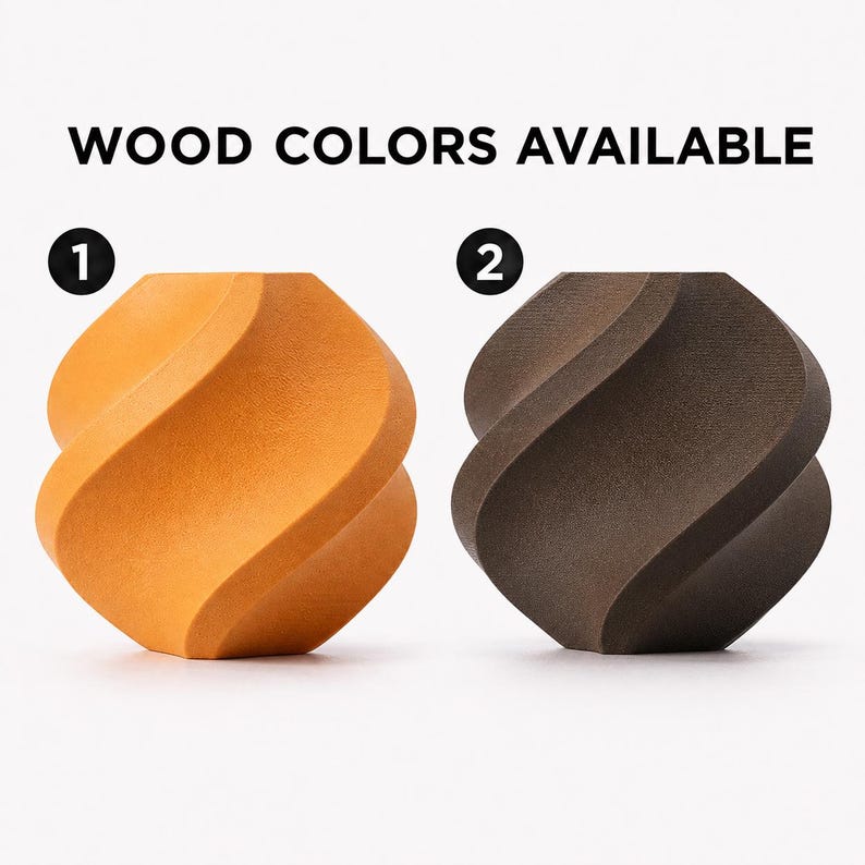 May include: Two wooden decorative objects with a twisted design. One is a light orange color, and the other is a dark brown. The text "WOOD COLORS AVAILABLE" is at the top of the image.