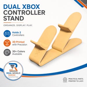 May include: A beige 3D-printed dual Xbox controller stand. The stand is designed to hold two controllers and features the Xbox logo. Text on the stand reads "DUAL XBOX CONTROLLER STAND" and "ORGANIZE. DISPLAY. PLAY."