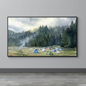 May include: Watercolor painting of a campsite in a forest. The artwork depicts several tents in a grassy clearing, surrounded by tall evergreen trees. A campfire is visible, with smoke rising towards the sky. The painting is framed in a black border.