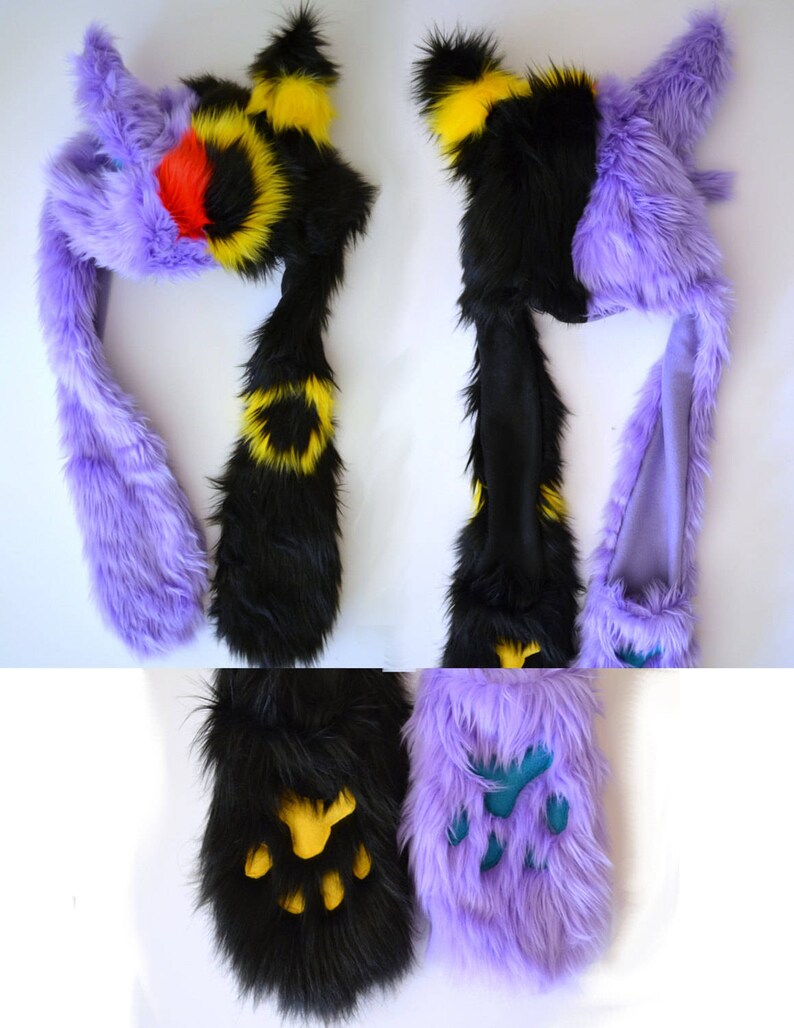 May include: Purple and black furry hat with a yellow and black striped tail. The hat has a long tail that can be worn as a scarf. The hat also has a pair of matching paw-shaped hand warmers.