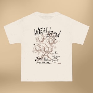 We All Grow floral illustration T-Shirt | botanical typography