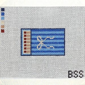 May include: A needlepoint canvas featuring a rectangular blue matchbook design with horizontal stripes and a white bow graphic. The left side shows a row of match heads in tan and dark red. A color palette key is in the top left corner, and the letters BSS are in the bottom right corner.