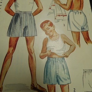 May include: A vintage sewing pattern for boys' shorts. The pattern includes three different styles of shorts: striped, solid blue, and white. The pattern is for size 8.