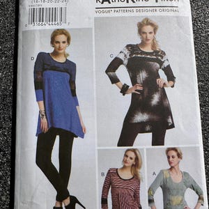 May include: A sewing pattern by Katherine Tilton for Vogue Patterns. The pattern features designs for women's tops and tunics. The pattern includes multiple views with different sleeve lengths and color block designs. The pattern number is V8817, and the size range is 16-18-20-22-24.