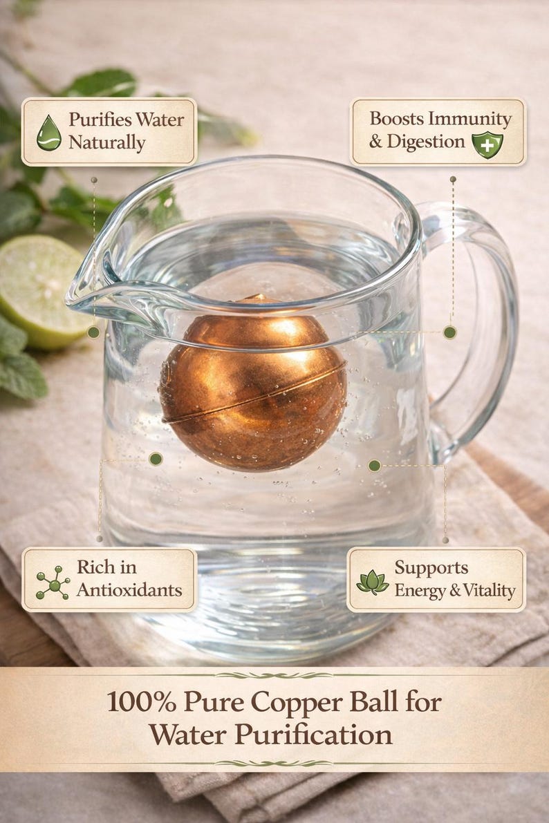 May include: A spherical copper ball submerged in a clear glass pitcher filled with water. Text labels state: Purifies Water Naturally, Boosts Immunity & Digestion, Rich in Antioxidants, Supports Energy & Vitality, and 100% Pure Copper Ball for Water Purification.