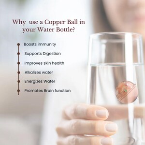 May include: A clear glass filled with water containing a small, round, metallic copper ball. Text on the left reads: Why use a Copper Ball in your Water Bottle? Boosts immunity, Supports Digestion, Improves skin health, Alkalizes water, Energizes Water, Promotes Brain function.