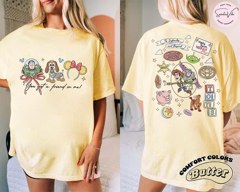 May include: Yellow t-shirt with front and back graphics. The front features Buzz Lightyear, a dog, and Minnie Mouse ears with text "You got a friend in me!". The back has Woody, Buzz, and other Toy Story characters.