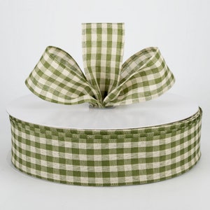 May include: A roll of green and white gingham ribbon. The ribbon is 2.5 inches wide and is perfect for crafting and decorating.