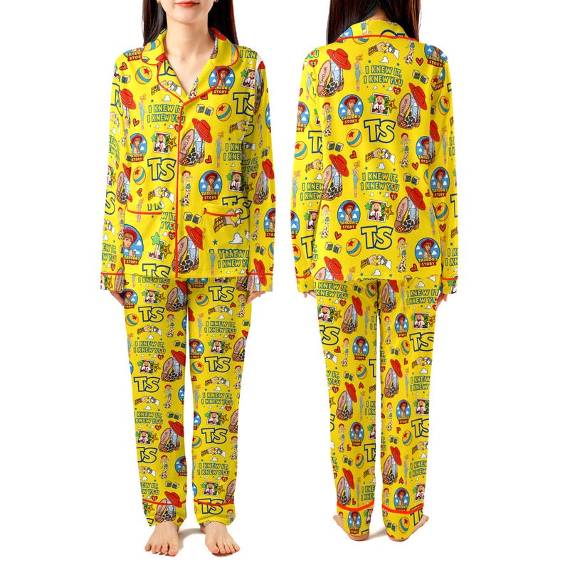 May include: A yellow long-sleeve pajama set with a button-down top and matching pants. The fabric features a repeating pattern of Toy Story characters, red hats, blue balls, and the text "TS" and "I KNEW IT, I KNEW YOU" in a colorful graphic print.